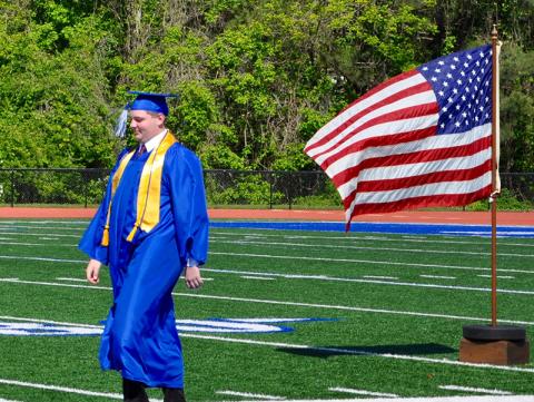 Zachary Nelson walks across Fannin County High School football field to receive his diploma during a private graduation ceremony Monday, May 11. The event was part of school officials’ plans to make graduation a memorable event for seniors amid COVID-19. A traditional ceremony is planned for May 22.