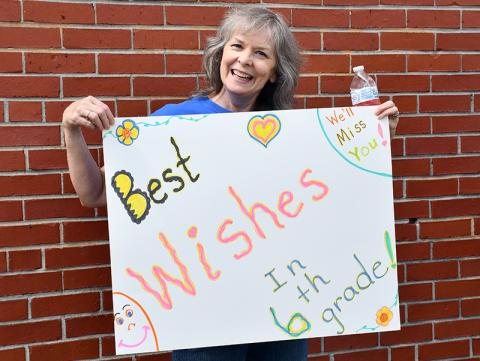 East Fannin Elementary School Paraprofessional Brenda Thomas sends her best wishes to the school’s graduating fifth grade students during the school’s Fifth Grade Parade Thursday, May 21. A similar event took place at Blue Ridge Elementary.