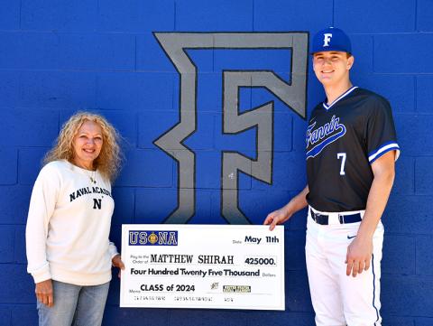 Fannin County High School Class of 2020 graduate Matthew Shirah will receive $425,000 to attend and play baseball for the United States Naval Academy starting this fall. He is shown with Blue and Gold Officer Susan Youngman.