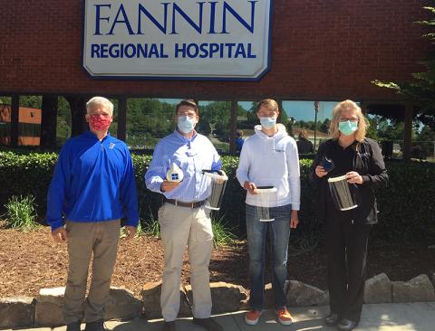 Fannin County High School freshman Bryce Ware created reusable mask, respirators and face shields for employees at Fannin Regional Hospital. Shown are, from left, Engineering teacher Bubba Gibbs, Fannin Regional Chief Executive Officer Jason Jones, Ware and Fannin Regional Executive Director of Nursing Stephanie Monico.
