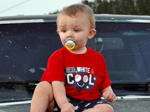 August Anderson sat beside his parents on the hood of a Jeep while waiting on Ducktown’s fireworks to blast off Saturday, June 27.