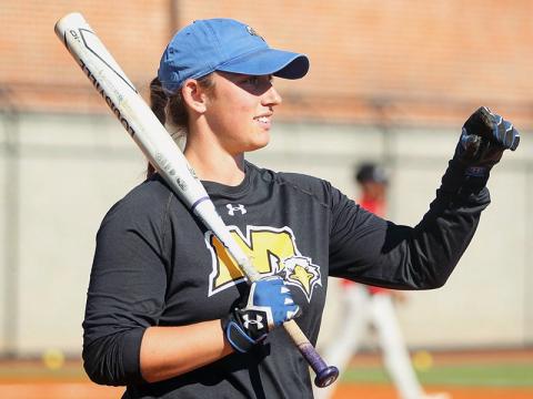 FCHS alumnus Karly Thompson warms up the team during her time as a Graduate Assistant Coach at Morehead State University.