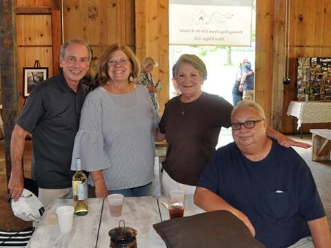 People started gathering around with their favorite drink and waited for the show to start at the Freedom For Fido fundraiser Thursday, July 23. Shown are, from left, Joe Lerro, Denice Vogel, Patsi Brantley and Ed Brantley.