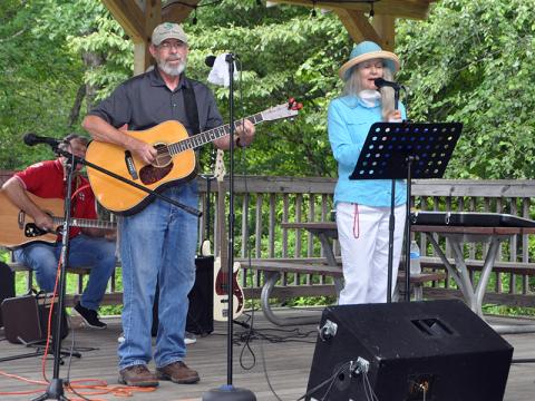 Jim and Marci Wilcox were among the performers during Pickin’ in the Park at Ron Henry Horseshoe Bend Park Thursday, July 9. Pickin’ returned to the park after being absent for almost ten months, and now continues back on schedule starting at 6 p.m. every Thursday.