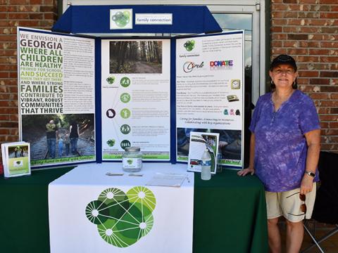 Fannin County Family Connection Executive Director Sherry Morris presented information about Family Connection during the Cars for a Cause car show fundraiser for the organization hosted by Lovin Racing and Circuit World Sunday, July 19.