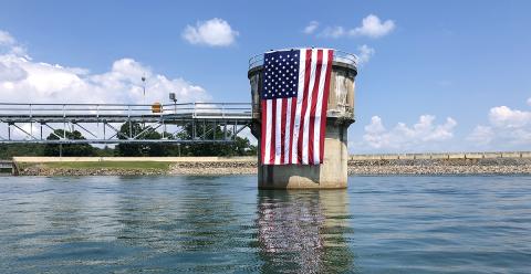 The Tennessee Valley Authority hung a huge American flag off the penstock at Blue Ridge Dam just in time for the Fourth of July. Tri-State EMC proudly displayed its flag from a boom truck at the office on Highway 5 south of McCaysville. Although crowds were smaller than some expected, thousands of people turned out for the annual fireworks displays in Blue Ridge and McCaysville/Copperhill.