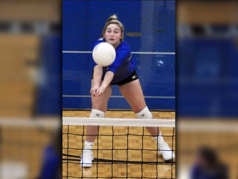 Paige Foresman keeps a volley alive during the Lady Rebels volleyball  match with Gilmer County Wednesday, August 12.
