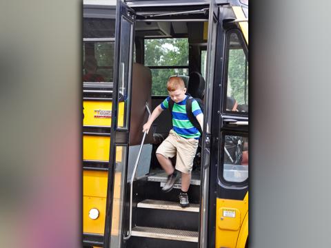 Zeke Payne shuffles to get off of the school bus at Blue Ridge Elementary School on the first day Friday, August 7.