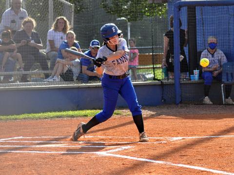 Riley Davis slugs a ball in recent action for the Fannin County Lady Rebel softball team.