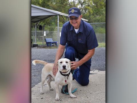 This male Bassett Hound mix was picked up on Highway 2 in Epworth September 16. He has a sandy, white coat and cocoa bean colored eyes. View him using intake number 260-20. He is shown with Animal Control officer Pat Patterson.