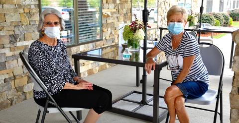 Blue Ridge Assisted Living & Memory Care resident Nancy McDowell, left, and her sister, Sheryle Roach, were able to visit Thursday, September 3, while following COVID-19 guidelines thanks to the facility’s recently implemented “front porch visits.” 