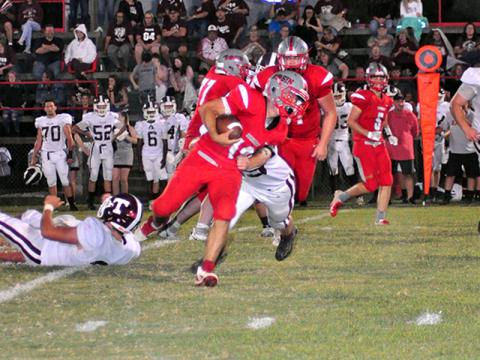 Copper Basin Cougar Sebastian Baliles (12) muscles his way through a defender in recent action for the Copper Basin Cougars football team.