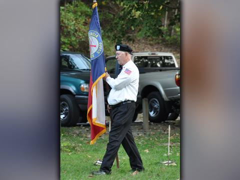 Veteran Bob Harrington posts the North Georgia Honor Guard flag at Ron Henry Horseshoe Bend Park Tuesday, October 20. Besides the ceremonial posting of the colors, the Flag Retirement ceremony included an explanation of the importance of properly retiring worn out United States flags by Epworth Scoutmaster David Lewis. Troop 32 scouts and honor guard members come together regularly to conduct retirement ceremonies.