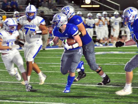 Fannin Rebel Seth Reece (5) takes the ball to the endzone, while Mason Bundy (70)  blocks a trailing defender during the Rebels 49-13 win over Banks Friday, October 2.
