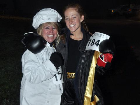 Barbara Galinski, left, and Jaque Galinski are all smiles as they wait to start the Bigfoot Boogie 5K race Saturday, October 31.
