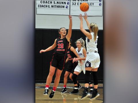 Lady Cougar Sapporiah Ross goes up to contest a jumpshot during Copper Basin’s game against Gilmer County Saturday, November 21.