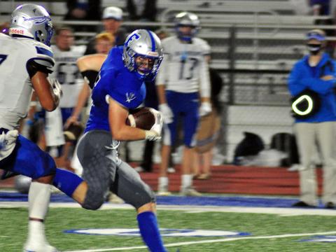 Seth Reece (5) outruns a defender for a big gain in recent action for the Fannin County Rebel football team.