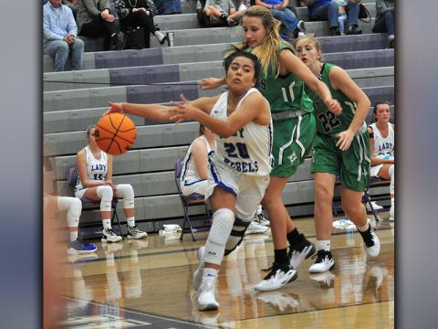 Lady Rebel Prisila Bautista drives past a Pickens defender during the Lady Rebels win against the Dragonettes Saturday, November 21.