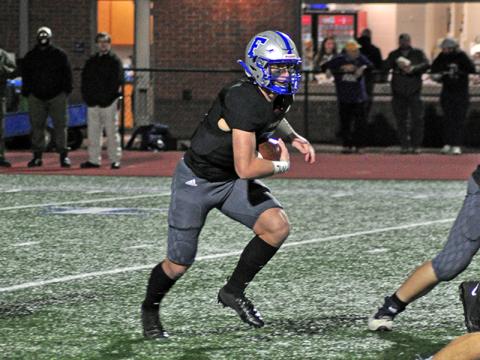 Rebel Seth Reece (5) find an open running lane during the Rebels playoff game against Fitzgerald Friday, December 11.