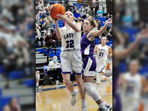 Lady Rebel Mackenzie Johnson goes up for a contested lay-up in recent action for Fannin County.
