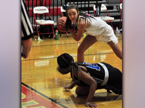 Lady Cougar Riley Smith steals the ball away from a Lady Patriot player during the Lady Cougars win against Chattanooga School for the Arts and Sciences Tuesday, January 12.