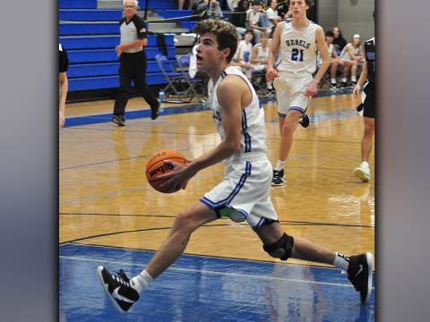 Tucker Hanson drives to the basket on a fastbreak in recent action for the Fannin County Rebels basketball team.