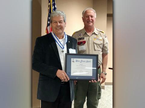 Jerry Whitehead, left, is the recipient of the 2020 Silver Beaver Award. Terry Bramlett, behind, presented the award to Whitehead.