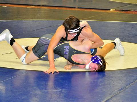 Corbin Davenport works his opponent in recent action for the Fannin County Rebels wrestling team.