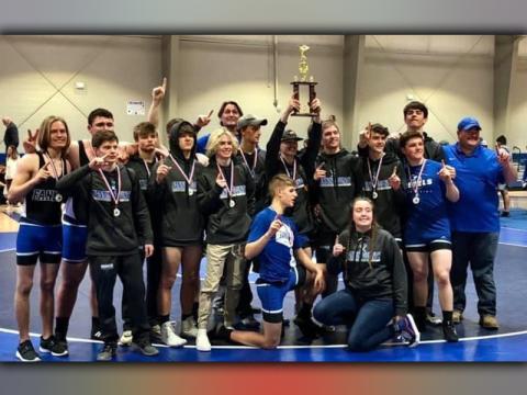 The Fannin County Rebels hoist the Area Championship trophy during their celebration Friday, February 5. This is the first time the Rebels have won an Area Championship since 2005.