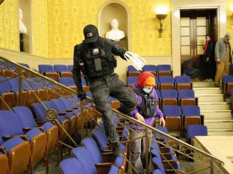 Eric Gavelek Munchel is allegedly shown in this picture during the invasion of the Capitol.