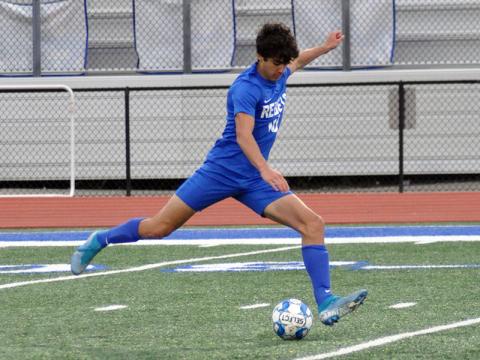 Hayden Lynch unloads on a kick during the Rebels game against Pepperell Friday, April 16.