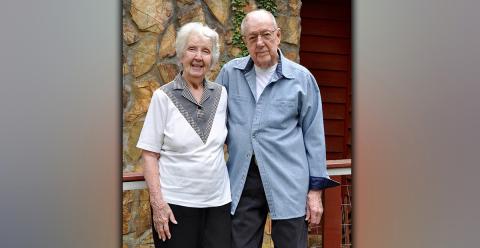 Mary and Peter Brown will celebrate 76 years of marriage April 20. They stand before the house they built together in Mineral Bluff.