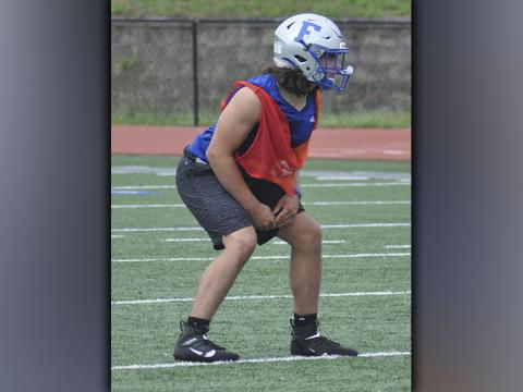 Andrew Waldrep gets lined up during the Rebels’ football practice Wednesday, June 9.