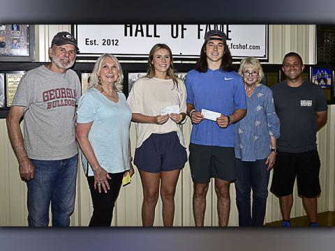 Photo by Allstar Photos The Fannin County Sports Hall of Fame recently awarded two Fannin County High School 2021 graduates with a $1,000 scholarship each. Shown during the scholarship presentation are, from left, Fannin Sports Hall of Fame members Don Clement and Sandy Acker, FCHS seniors and scholarship recipients Olivia Sisson and Luke Holloway, Sports Hall of Fame members Gilita Carter and Tim Towe.