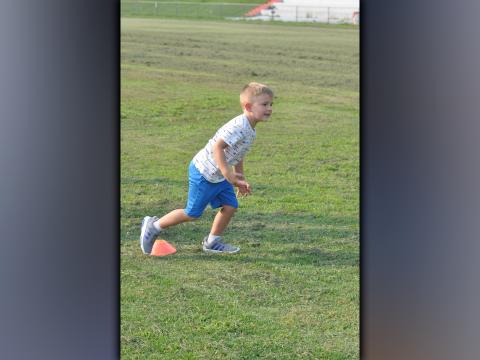 Josey Payne learns what foot to lead off with during Copper Basin’s youth football camp Thursday, July 22.