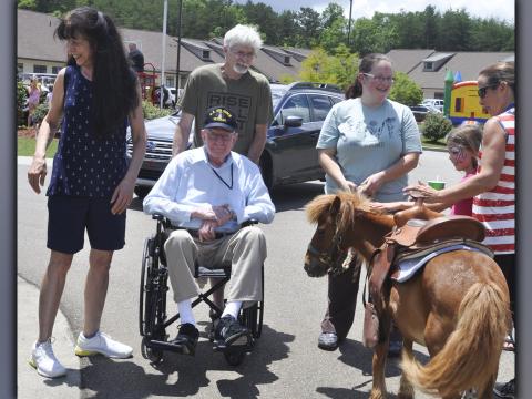 Among those enjoying the festivities at Blue Ridge Assisted Living and Memory Care Friday, July 2, are, clockwise, from left, Judy Overvoid and Chris Overvoid with Judy’s father, U.S. Air Force veteran John Turgeon. 