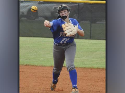 Riley Davis throws a runner out at first during the Lady Rebels win against Chestatee Wednesday, August 25.