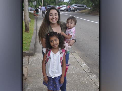 Shown on the first day of school at Blue Ridge Elementary School Friday, July 30, are, clockwise, first grader Peyton Neal, her mother Whitney Neal, and little sister Harper Neal.