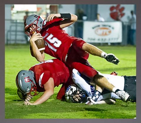 Photo courtesy All Star Photos // Copper Basin senior Joe Boggs fights for yardage against Sale Creek Friday night. Boggs rushed for 63 yards and threw for 170 in the game.