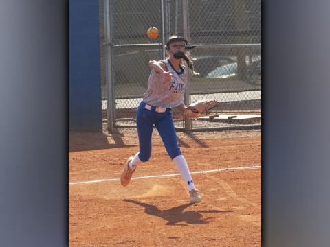 Aaleyah Rogers tries to throw a runner out in recent action for the Lady Rebel softball team.