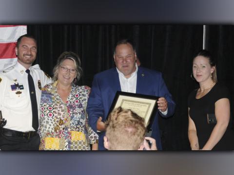 Mike Galinski, third from left, received a special Award of Appreciation from the Governor’s Office of Highway Safety for his efforts to help bring the traffic enforcement Quad Network Banquet to McCaysville last week. Also shown are, from left, McCaysville Police Chief Mike Earley, who presented the award, and Karen Hawkins and Emily Hawkins who manage Galinski’s restaurants and music venue in McCaysville.