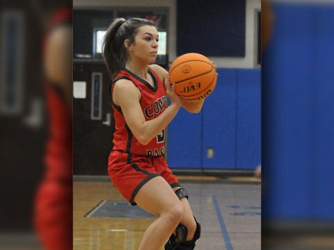 Syndey Hickey lines up a three point basket during the Lady Cougars game against Gilmer County Tuesday, November 23.