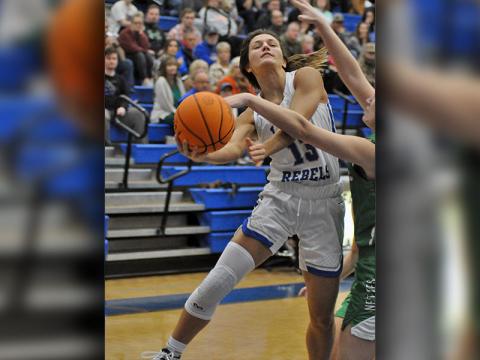 Lady Rebel Becca Ledford fights through contact for a two-point basket during the Lady Rebels basketball game against Gilmer County Monday, November 22.