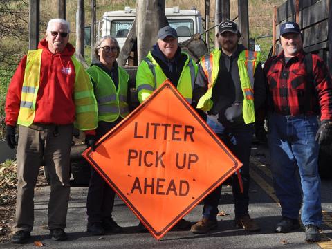 Citizens from Turtletown and Farner came together Saturday, November 20, to help remove a large mound of metal and trash that had been piling up for years along Waller Road in Farner. Shown are, from left, Mike and Karen Herring, Tennessee Litter Grant Director for Polk County William Wallace, Zeke Brendle and Ronney Freeman. 