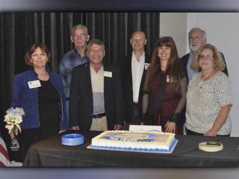The Copperhill Kiwanis Club celebrated 100 years of serving the Copper Basin with a dinner and silent auction Tuesday, November 9. Kiwanis Club members and officers shown are, from left, front, Treasurer Shirley Crane, President Howard Jabaley, Julie Colgate and Tamberlyn Tanner; back, Cecil Arp, Anthony Colgate and Secretary Don Wirtz. 