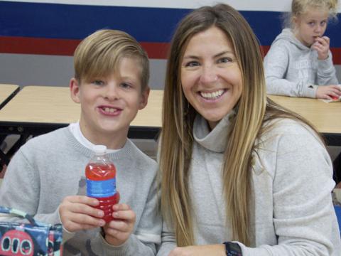 Kanoa, left, and Thorin Hanna enjoy lunch together at Blue Ridge Elementary School for their Thanksgiving lunches Wednesday, November 17.