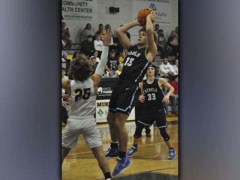 Chasen Ethington shoots a fadeaway jumper Saturady, December 4, when the Fannin County High School Rebels basketball team took on the Murphy Bulldogs.