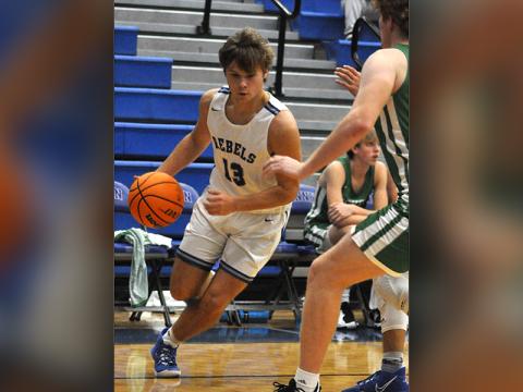 News Observer photo/Caleb Collins Chasen Ethington gets past a defender on the way to a two-point basket in recent action for the Fannin County Rebels basketball team. Ethington had 19 points in the Rebels match up against the Johns Creek Gladiators Wednesday, December 29.