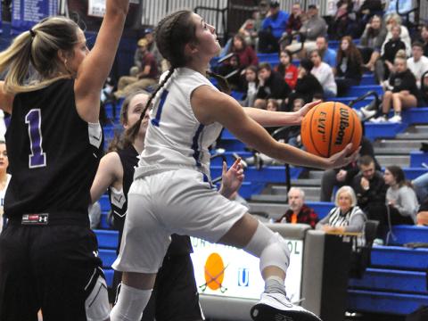 Courtney Davis finesses a two-point basket in recent action for the Fannin County Lady Rebel basketball team.