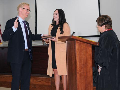 Frank Wood is shown taking his oath of office as the new chief assistant district attorney for the Appalachian Judicial Circuit from Chief Superior Court Judge Brenda Weaver. Holding the Bible for Wood is his fiancee, Kali Henderson. Wood was named to his new position by District Attorney B. Alison Sosebee.